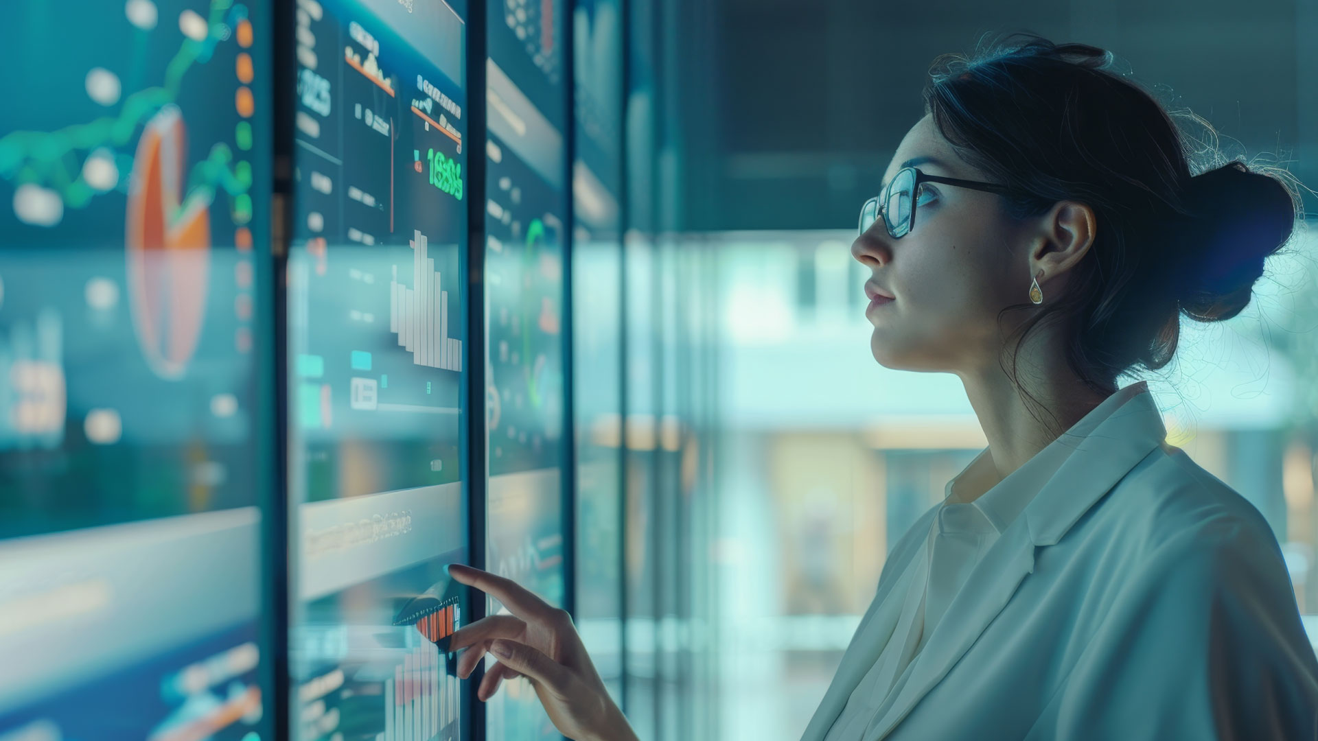 Professional reviewing digital dashboards to support data-driven decisions, system transformation, and enterprise technology services.